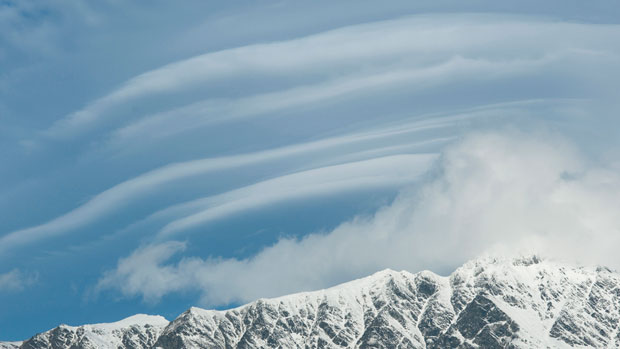 Cloud formations over mountain range.